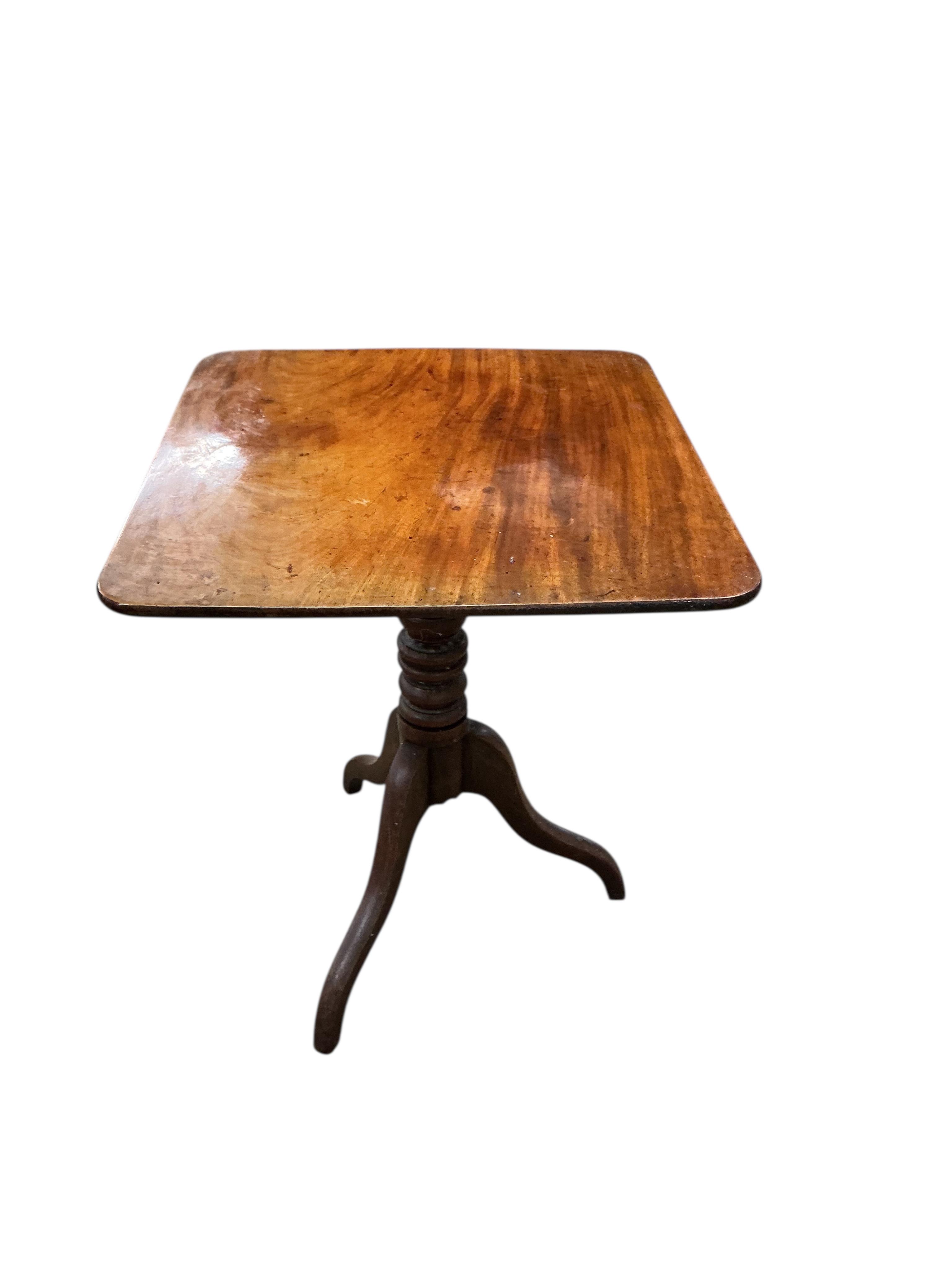 A Regency rectangular mahogany tilt top tripod tea table, width 65cm, depth 60cm, height 74cm